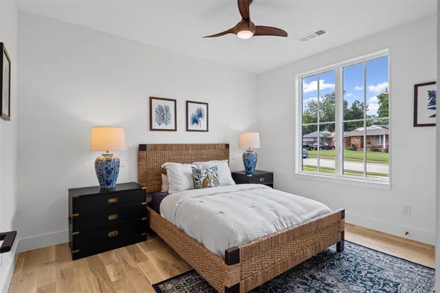 a bedroom with a bed and window
