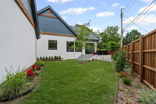 a front view of house with yard and outdoor seating