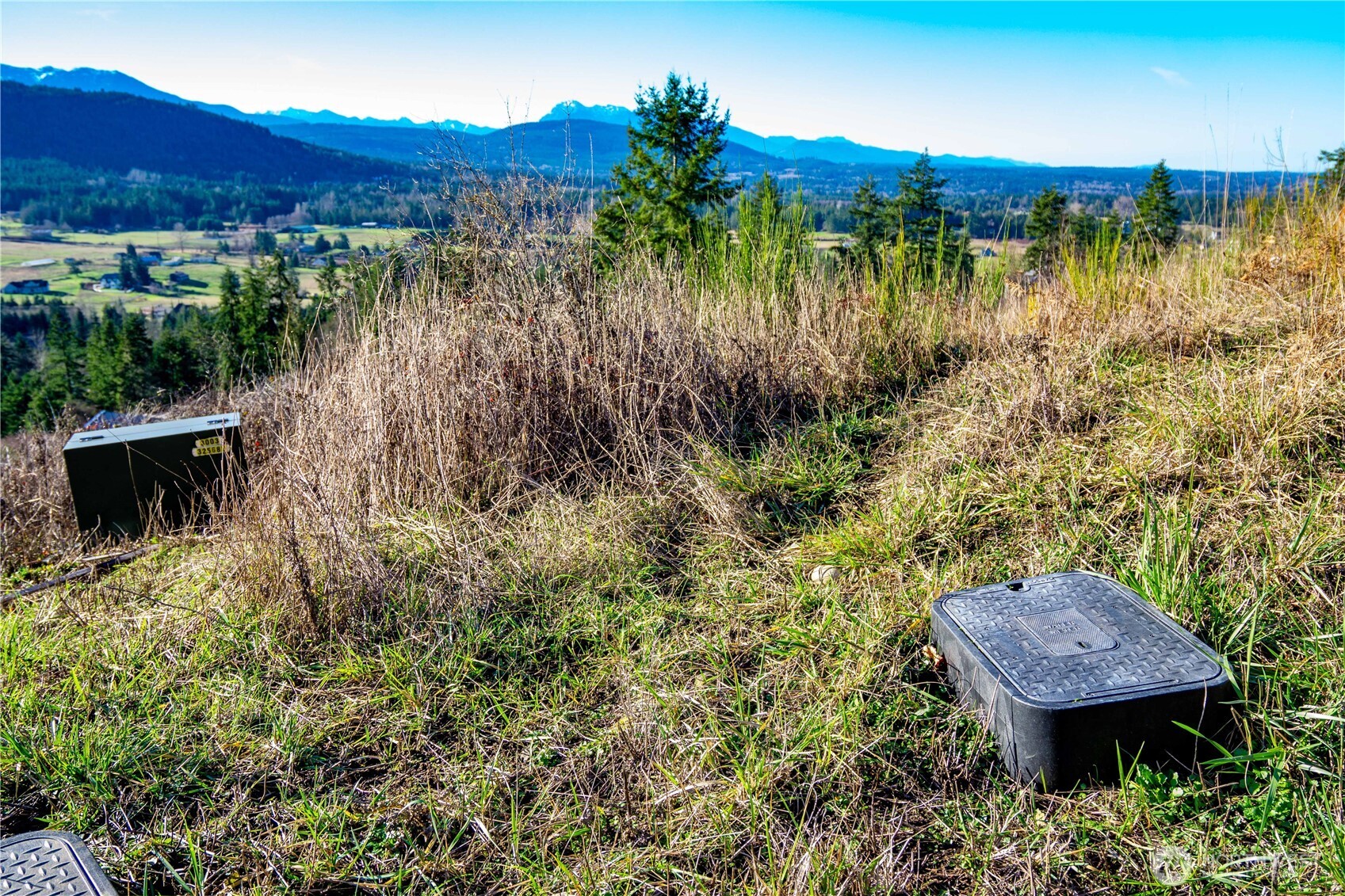 3 Hillside Drive Sequim, WA 98382 - Photo 13 of 27 a view of a backyard with a lake view