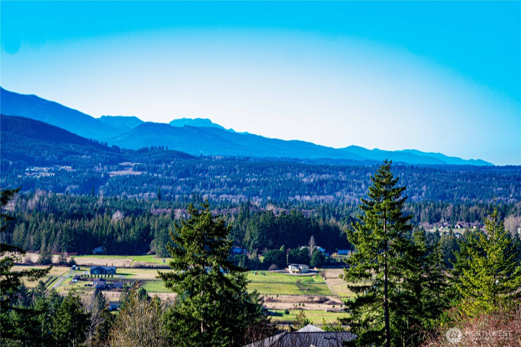 3 Hillside Drive Sequim, WA 98382 - Photo 19 of 27 a view of a lake with mountains in the background