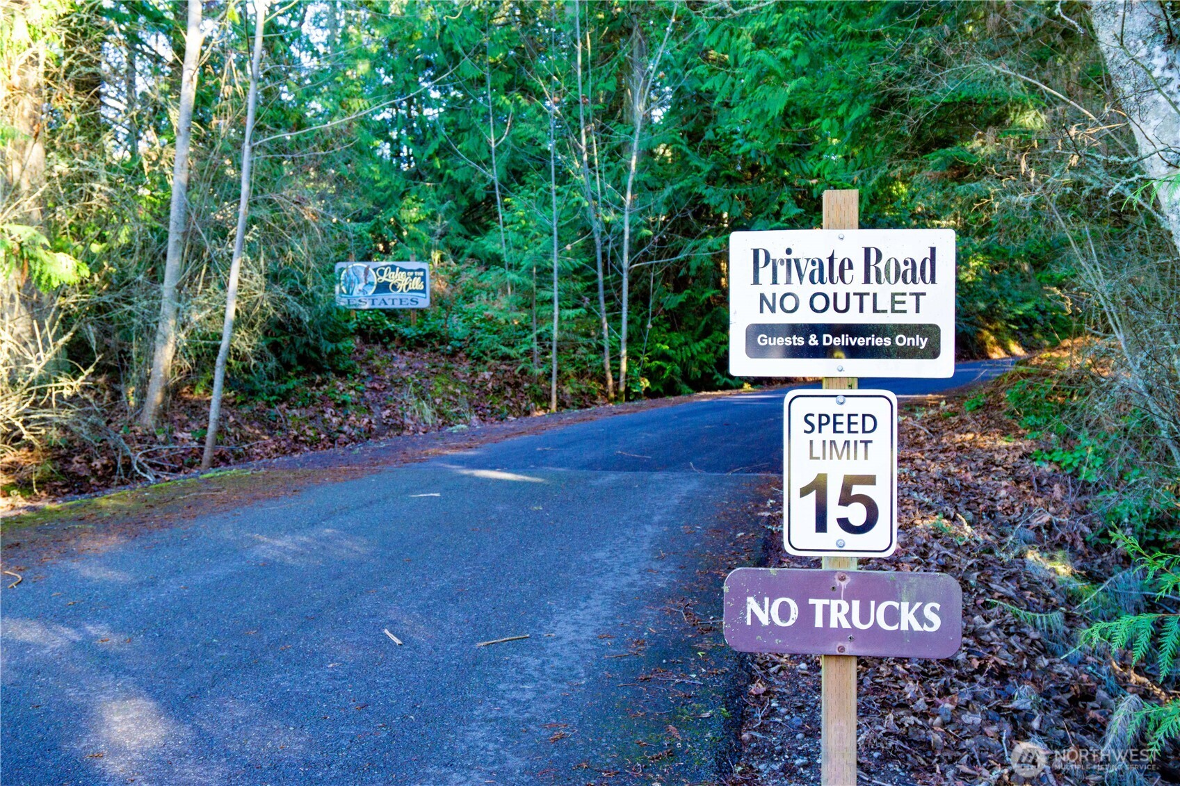 3 Hillside Drive Sequim, WA 98382 - Photo 26 of 27 a sign on a pole on a street