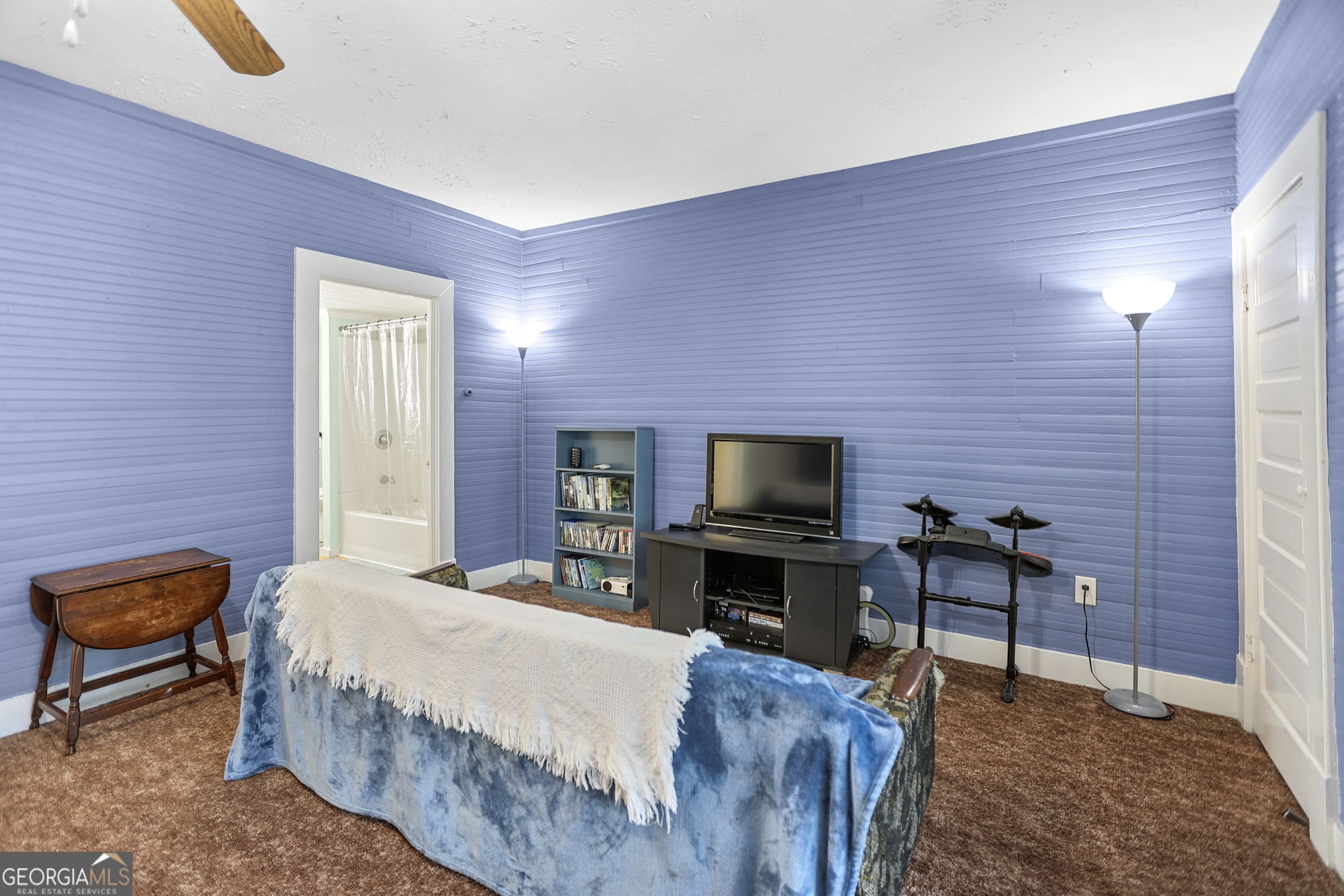 1205 Terrell Street Greenville, GA 30222 - Photo 28 of 50 a bedroom with a bed and a television in it