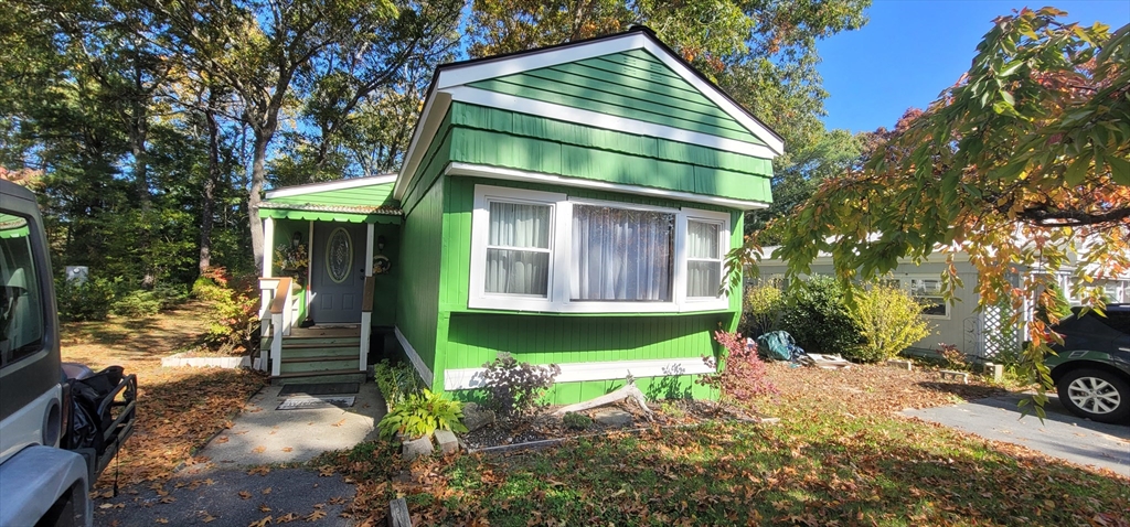 25 Windswept Road Wareham, MA 02571 - Photo 1 of 39 a front view of a house with garden