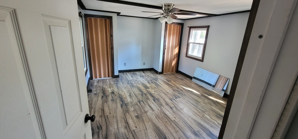 25 Windswept Road Wareham, MA 02571 - Photo 29 of 39 a view of empty room with wooden floor and fan
