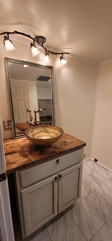 25 Windswept Road Wareham, MA 02571 - Photo 35 of 39 a bathroom with a sink and a mirror