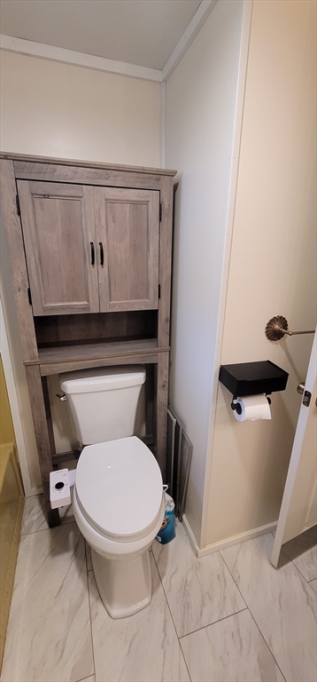 25 Windswept Road Wareham, MA 02571 - Photo 37 of 39 a white toilet sitting next to a shower