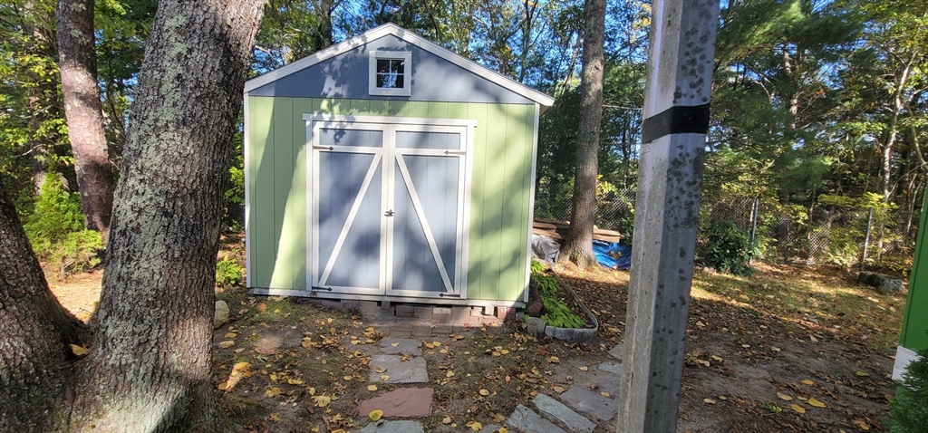 25 Windswept Road Wareham, MA 02571 - Photo 5 of 39 a front view of a house with a yard