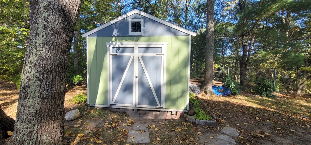 25 Windswept Road Wareham, MA 02571 - Photo 6 of 39 a front view of a house with a yard