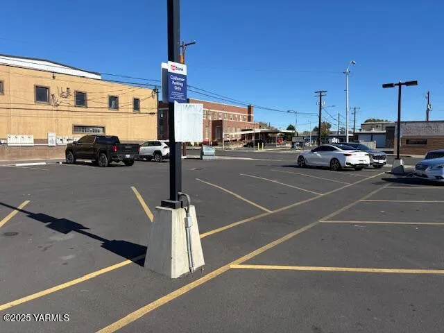 a view of a cars park on the road