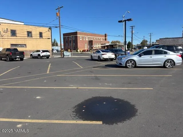 a view of a city street with cars