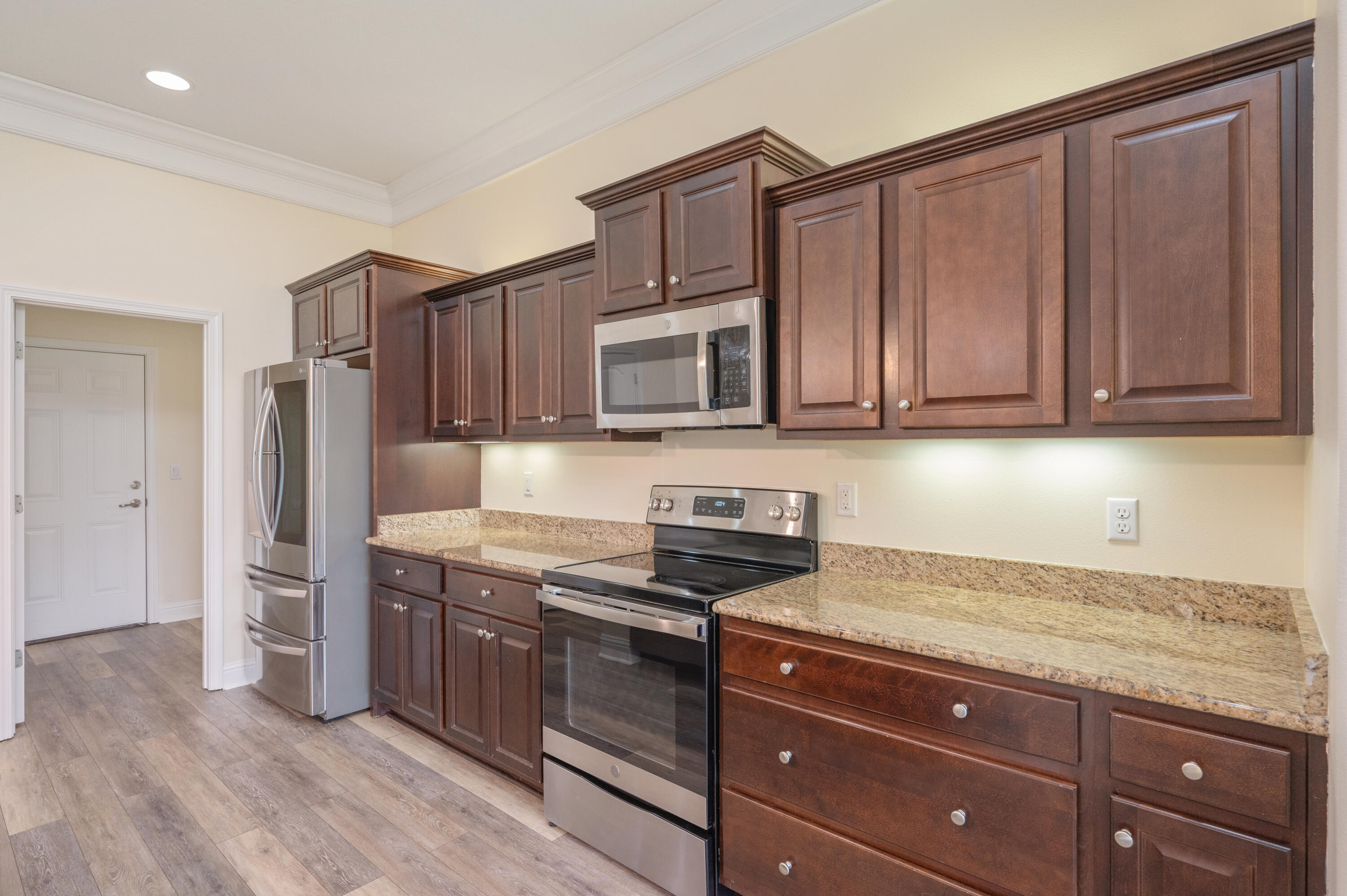 3361 Citrine Circle Crestview, FL 32539 - Photo 11 of 34 a kitchen with stainless steel appliances granite countertop a refrigerator and cabinets