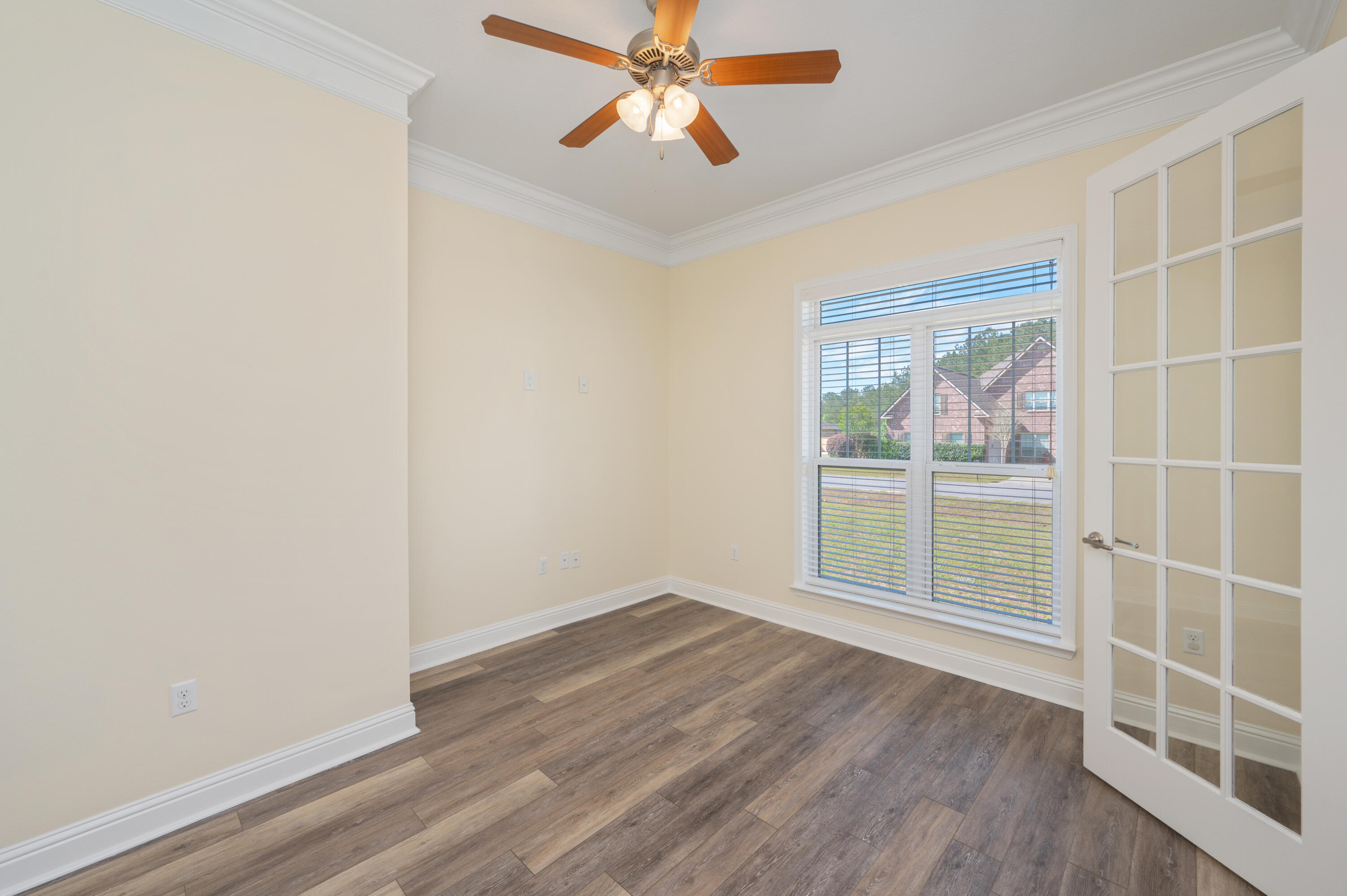 3361 Citrine Circle Crestview, FL 32539 - Photo 15 of 34 wooden floor in an empty room with a window