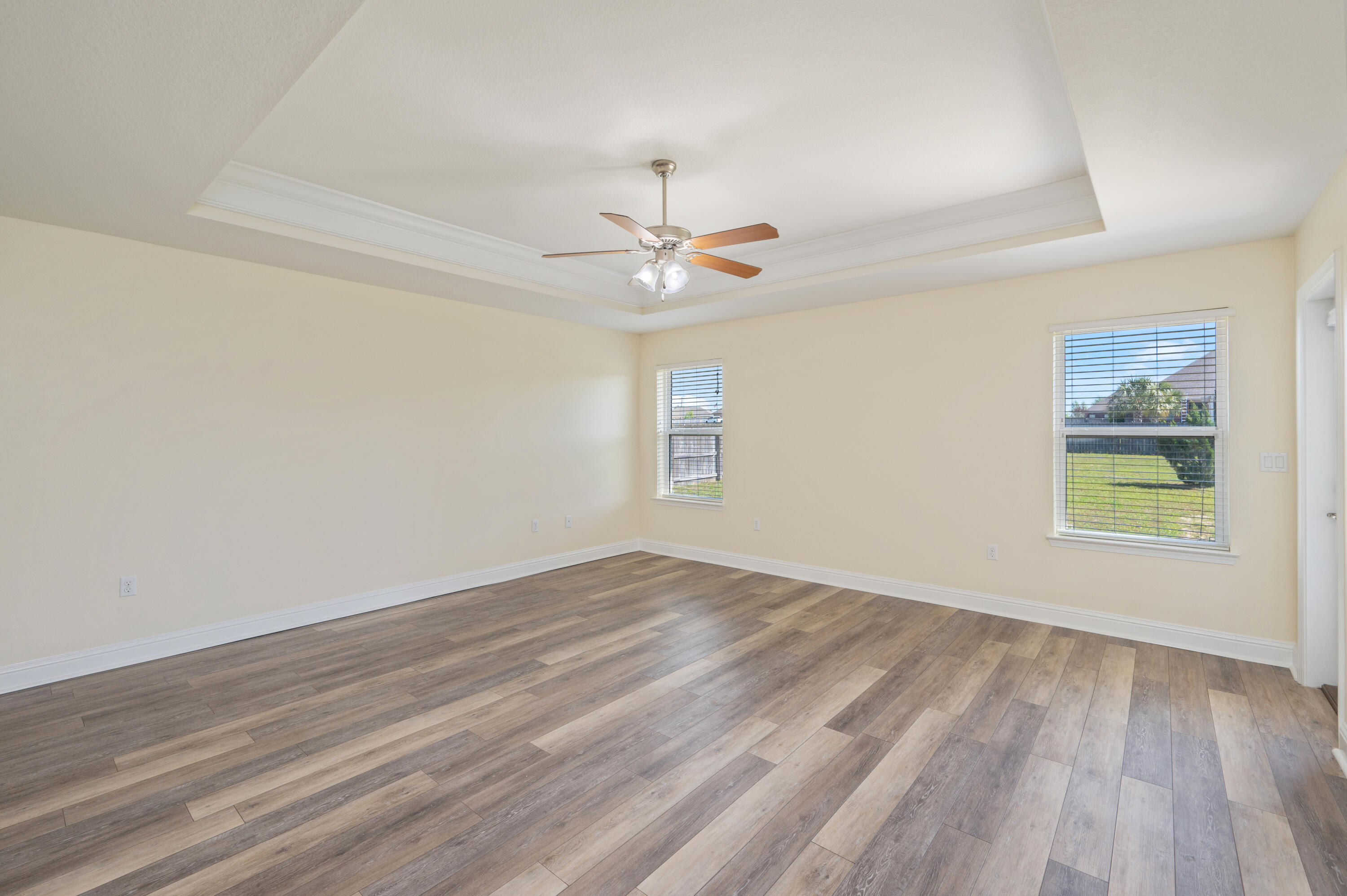 3361 Citrine Circle Crestview, FL 32539 - Photo 17 of 34 wooden floor in an empty room with a window