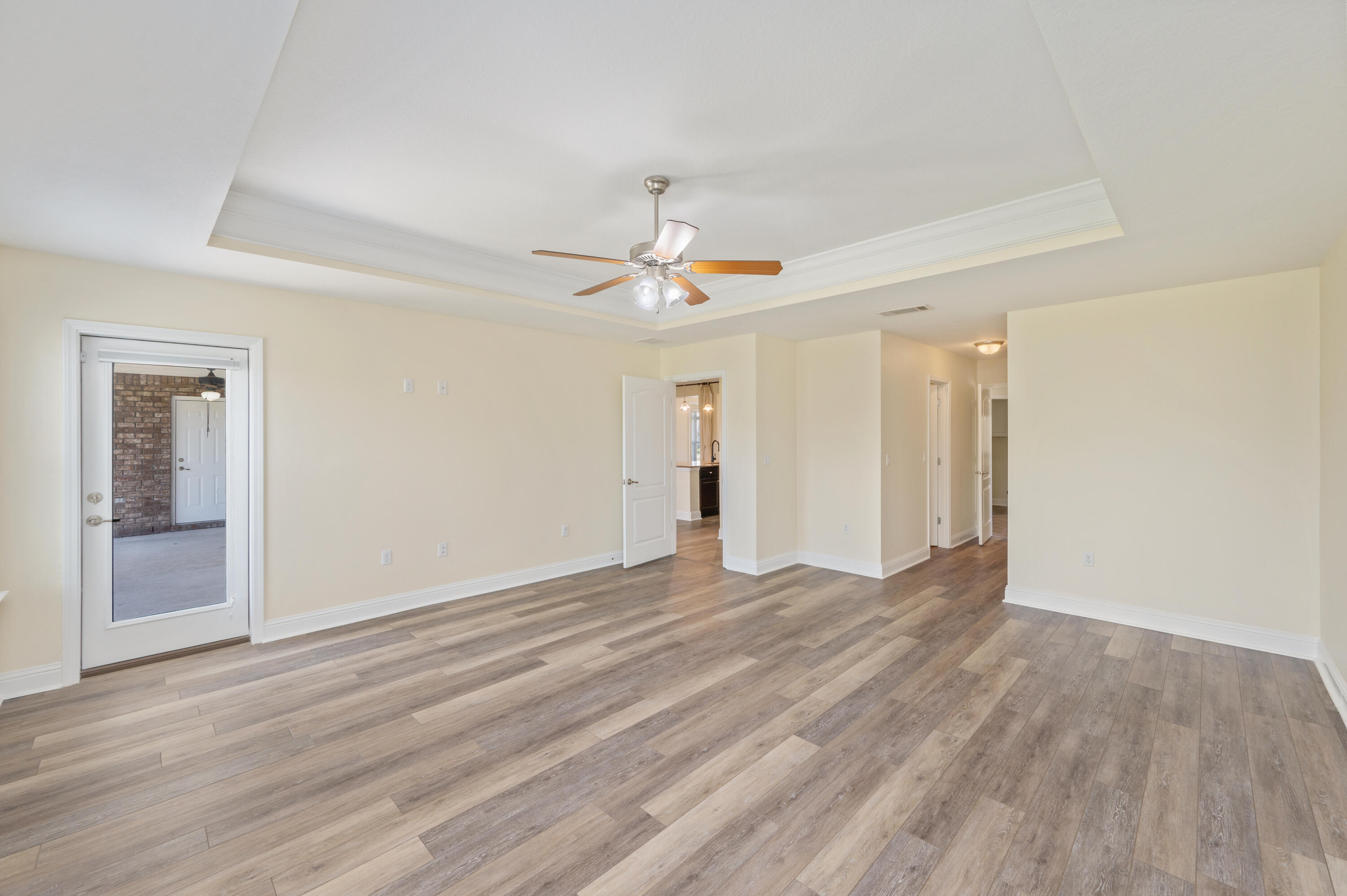 3361 Citrine Circle Crestview, FL 32539 - Photo 18 of 34 wooden floor in an empty room with a window