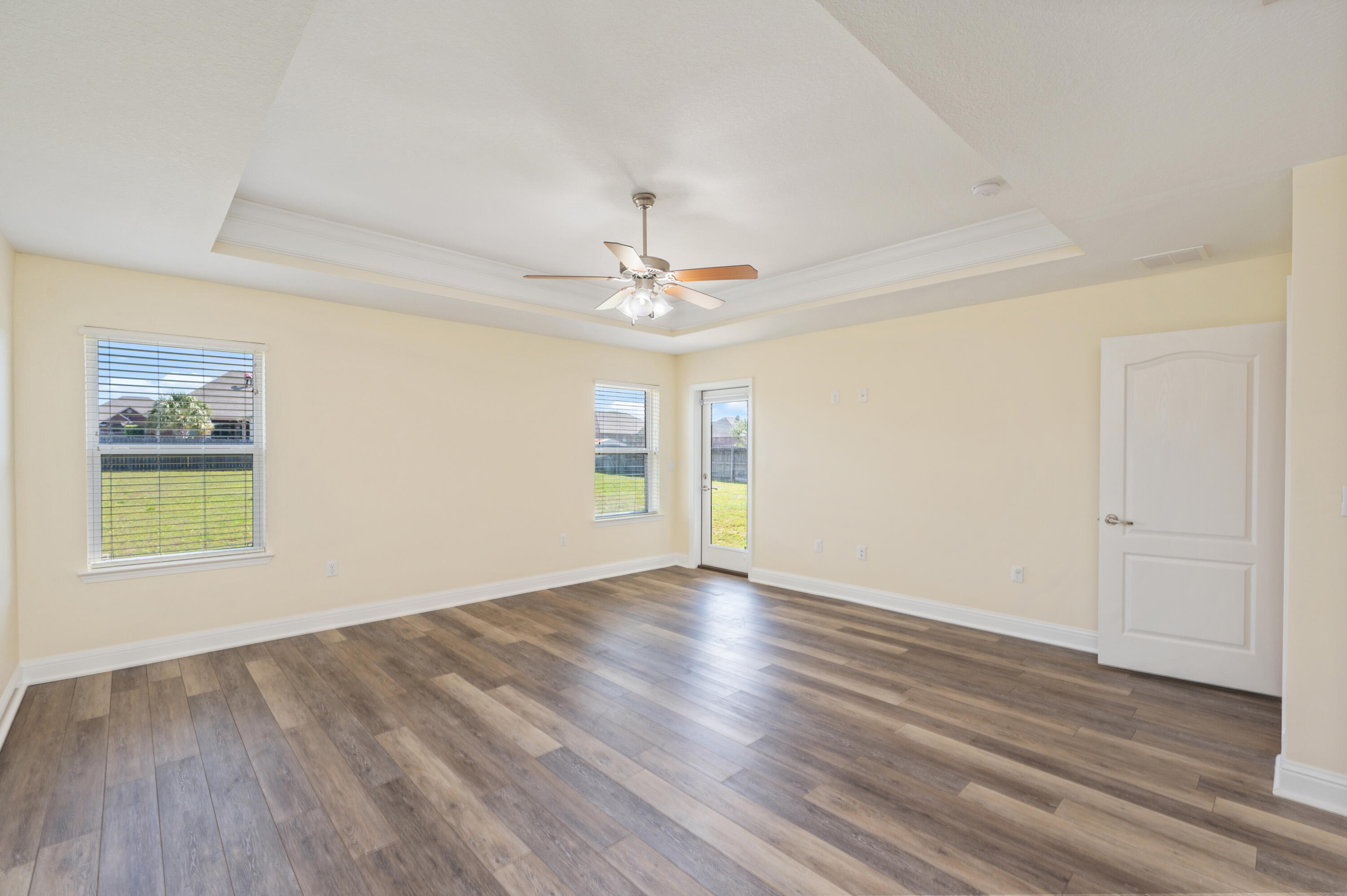 3361 Citrine Circle Crestview, FL 32539 - Photo 19 of 34 wooden floor in an empty room with a window
