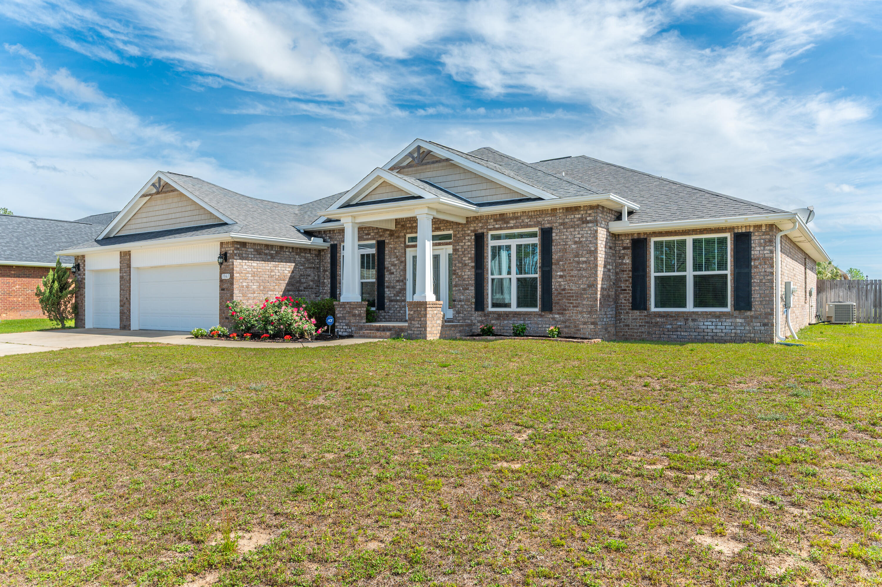 3361 Citrine Circle Crestview, FL 32539 - Photo 2 of 34 a front view of a house with garden