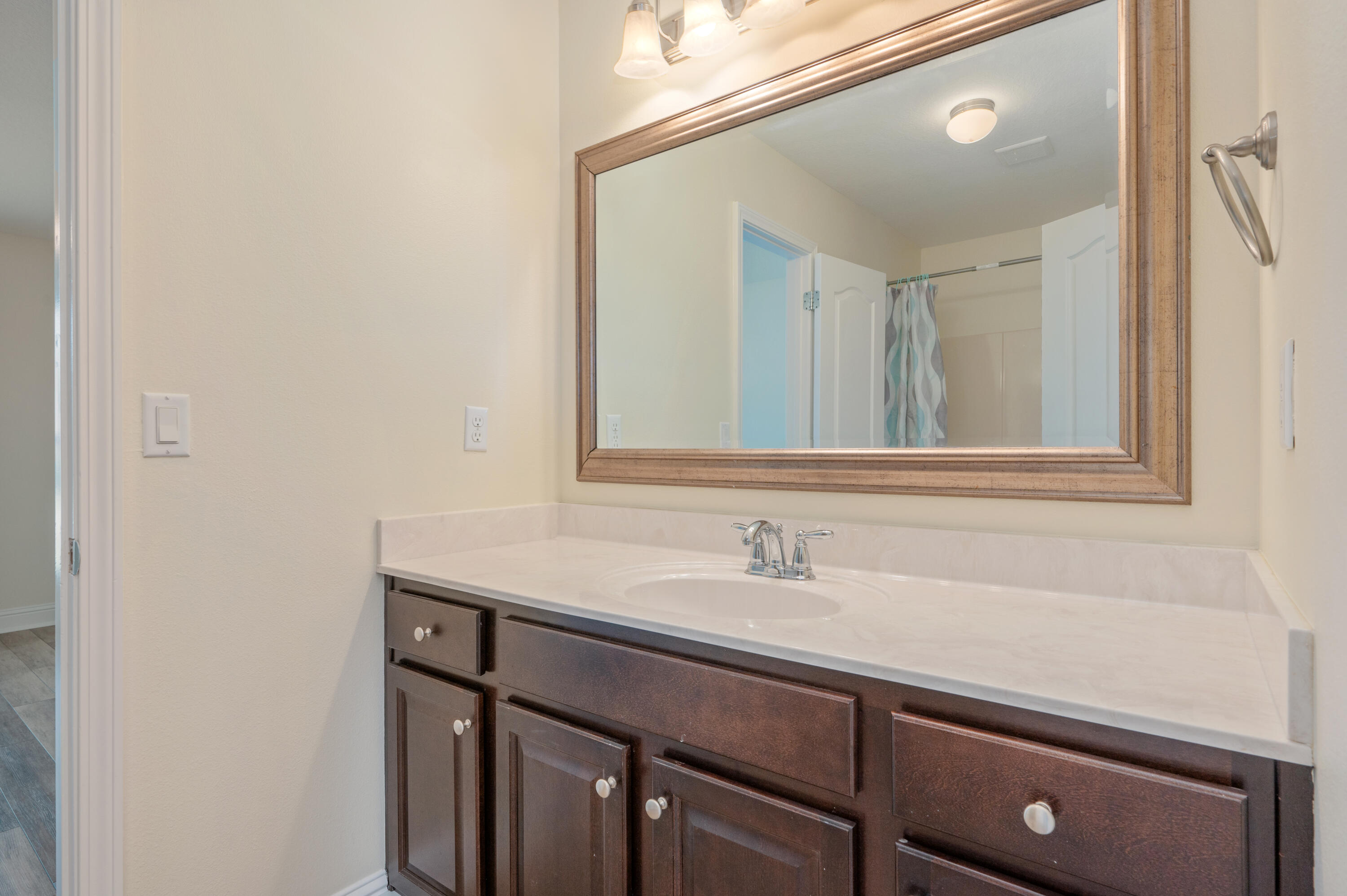 3361 Citrine Circle Crestview, FL 32539 - Photo 27 of 34 a bathroom with a sink and a mirror