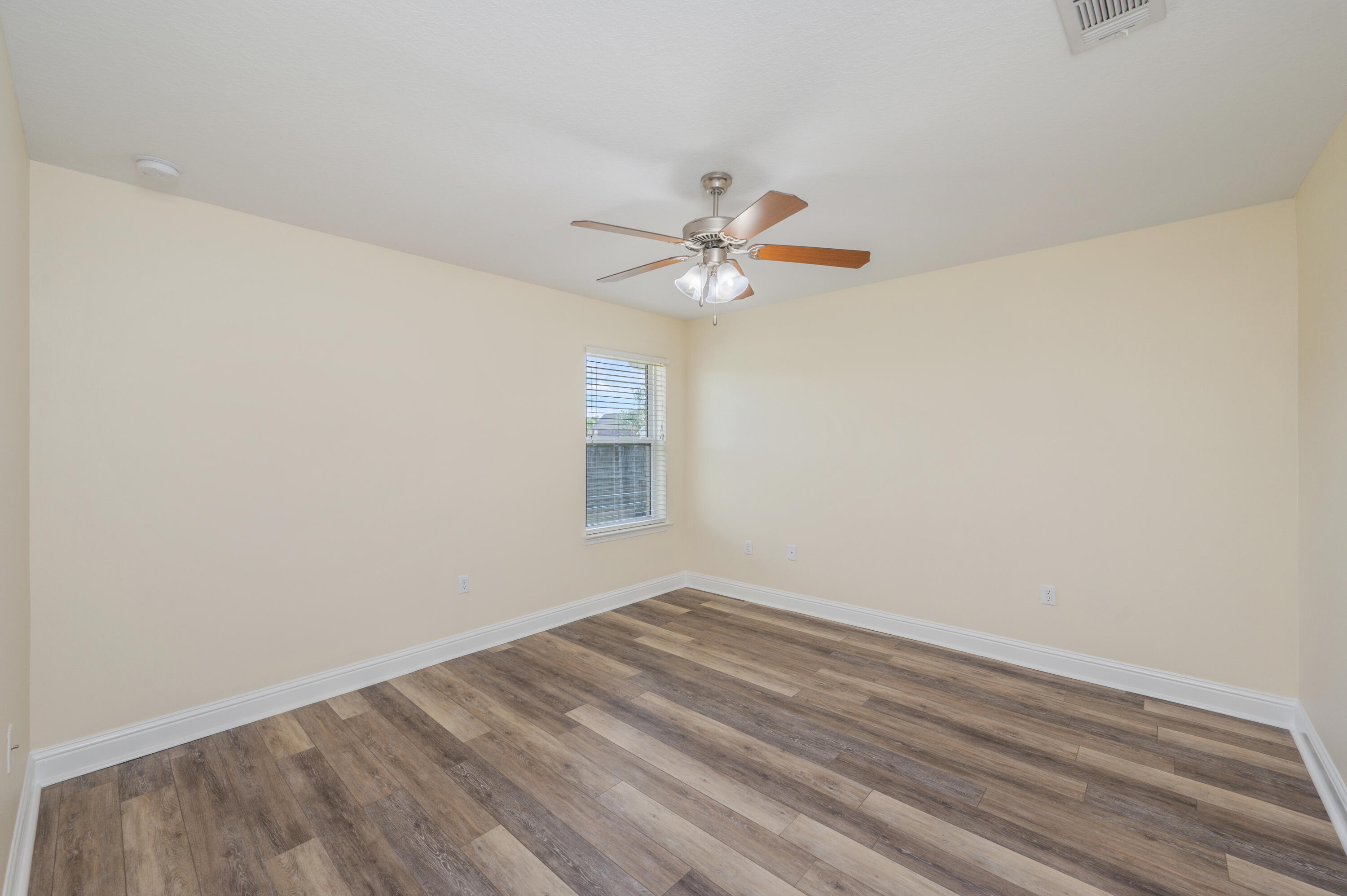 3361 Citrine Circle Crestview, FL 32539 - Photo 28 of 34 an empty room with a window and a fan