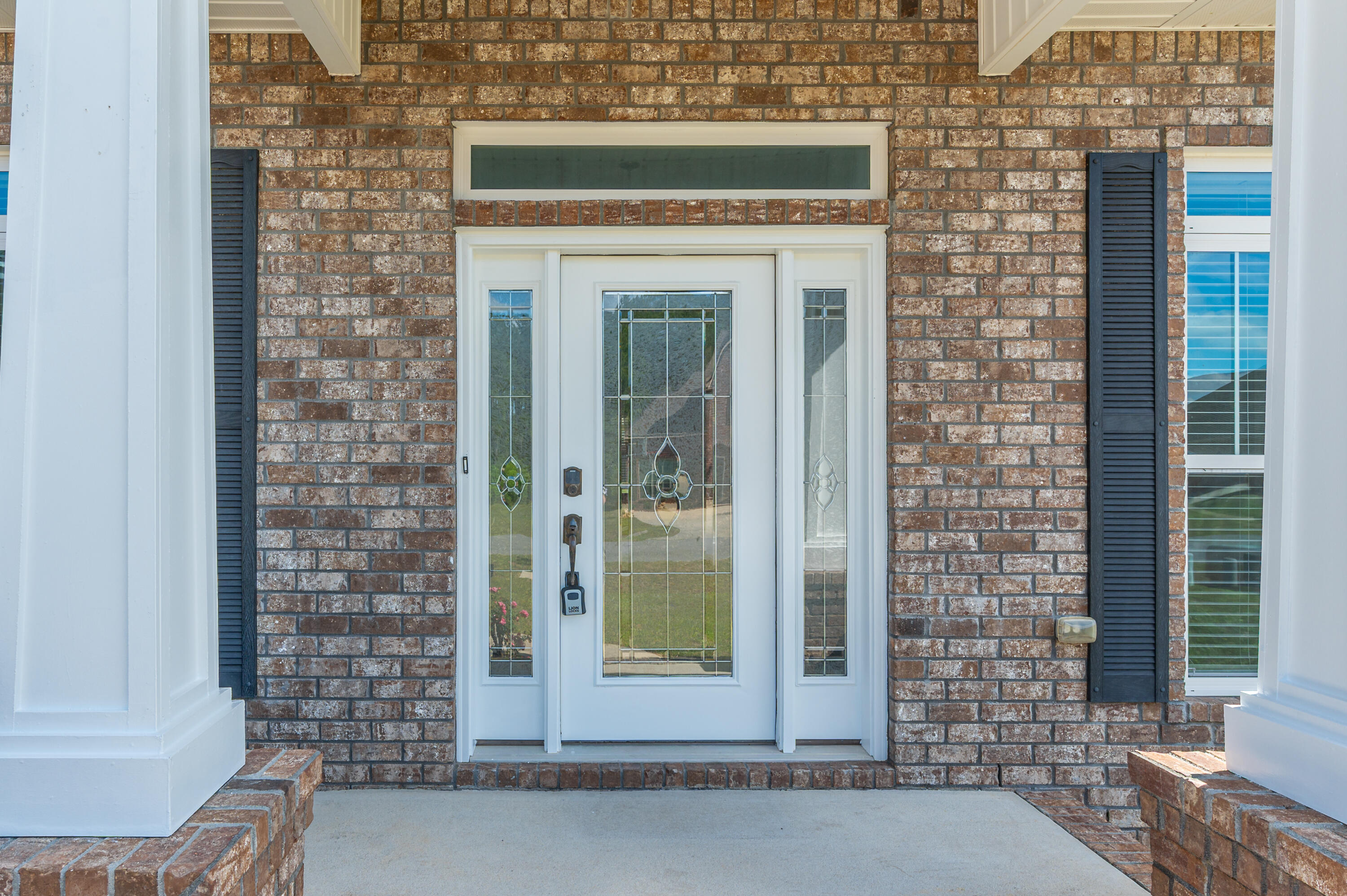 3361 Citrine Circle Crestview, FL 32539 - Photo 3 of 34 a front view of a house with a glass door
