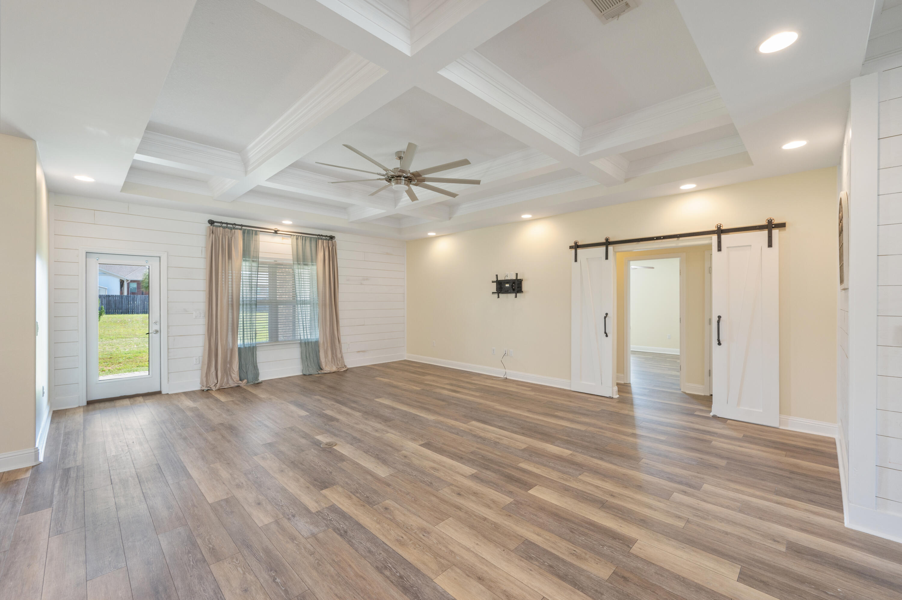 3361 Citrine Circle Crestview, FL 32539 - Photo 5 of 34 a view of an empty room with wooden floor and a window