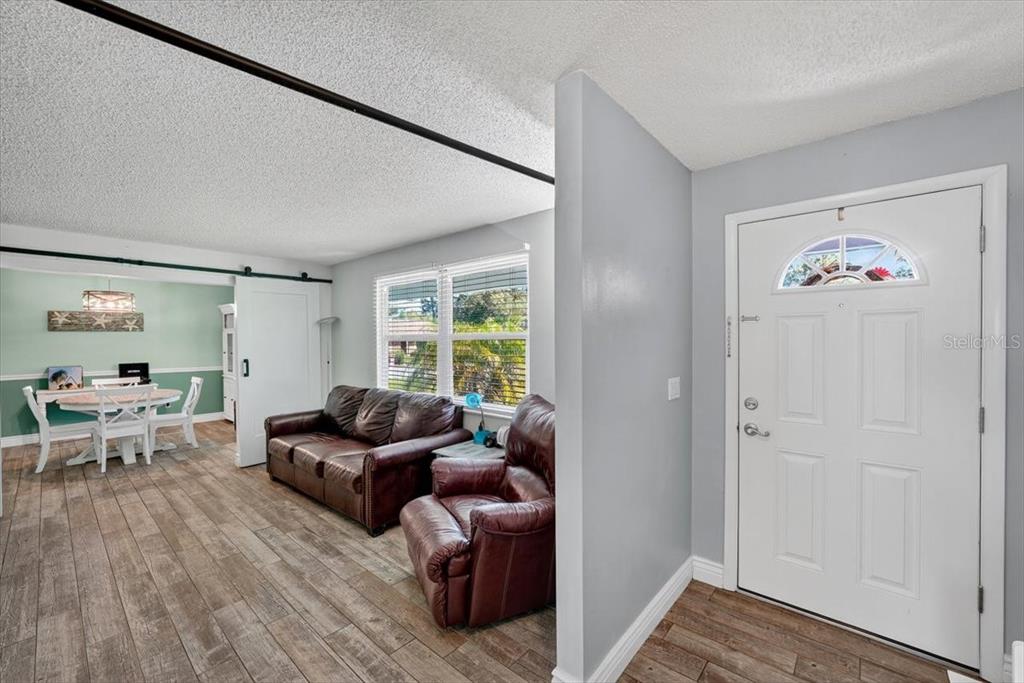 24 Heather Lane Ormond Beach, FL 32174 - Photo 13 of 50 a living room with furniture and a window