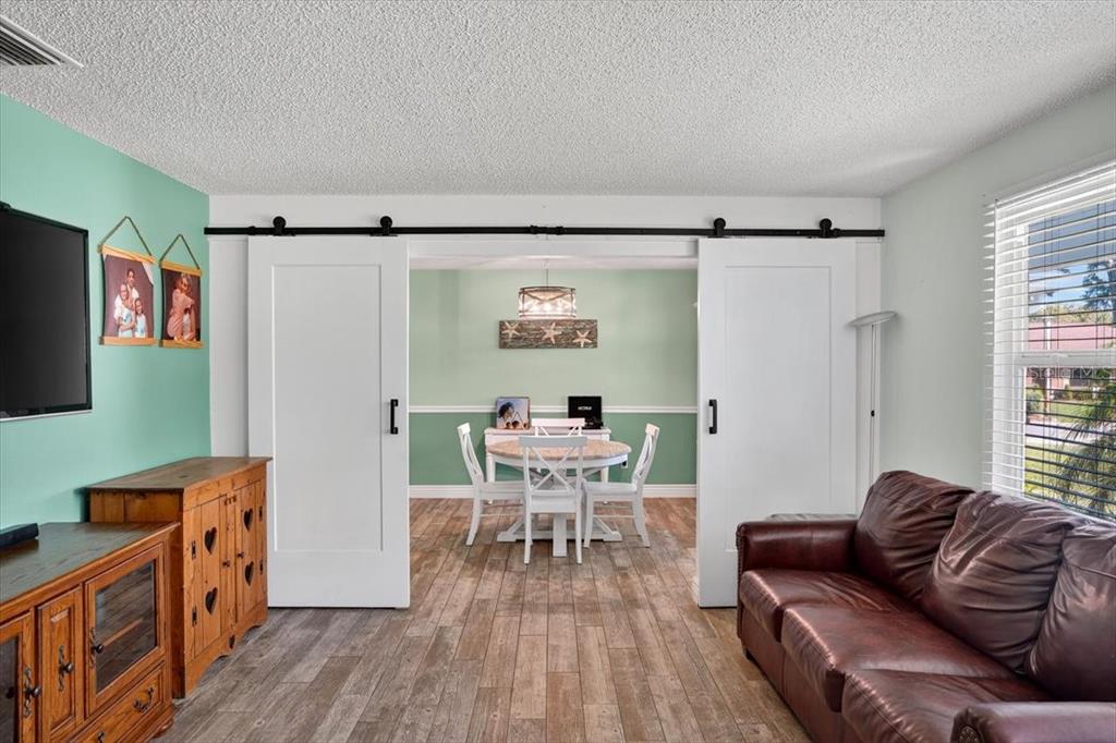 24 Heather Lane Ormond Beach, FL 32174 - Photo 15 of 50 a living room with furniture and a wooden floor