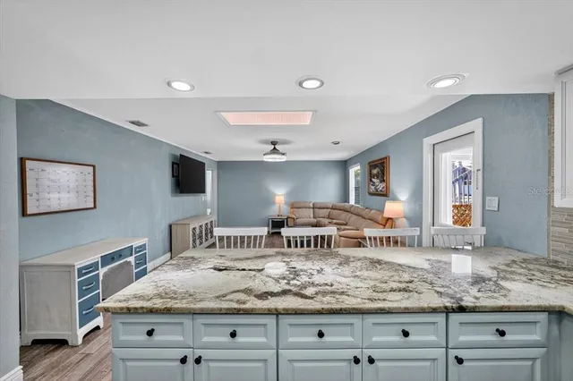 a view of living room with furniture and flat screen tv