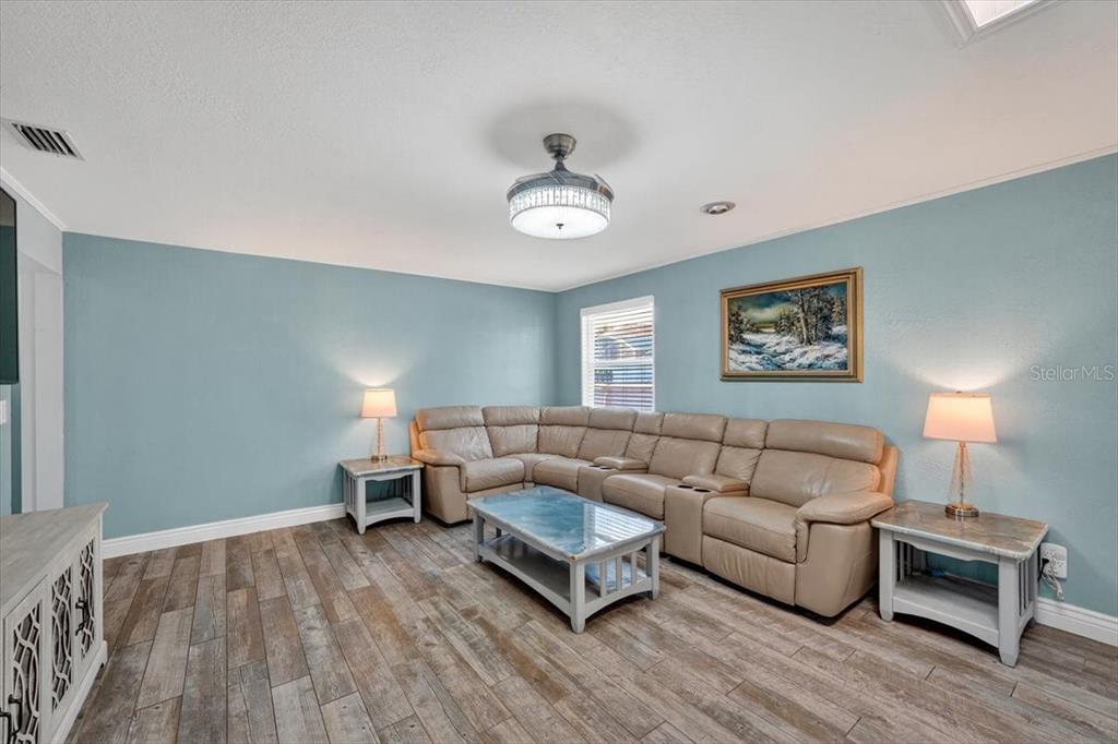 24 Heather Lane Ormond Beach, FL 32174 - Photo 27 of 50 a living room with furniture and a wooden floor