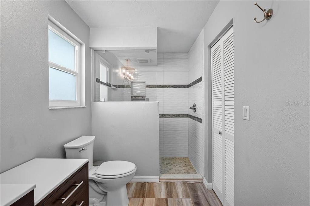 24 Heather Lane Ormond Beach, FL 32174 - Photo 35 of 50 a bathroom with a toilet and a shower