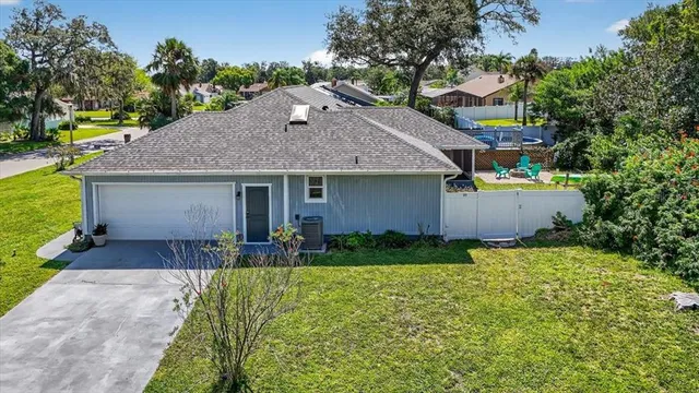 a front view of house with yard and green space