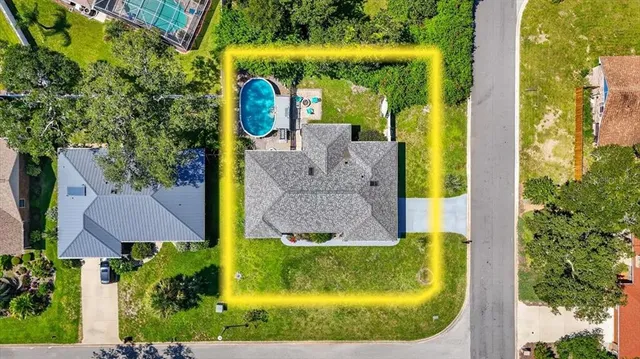 an aerial view of a house with a swimming pool