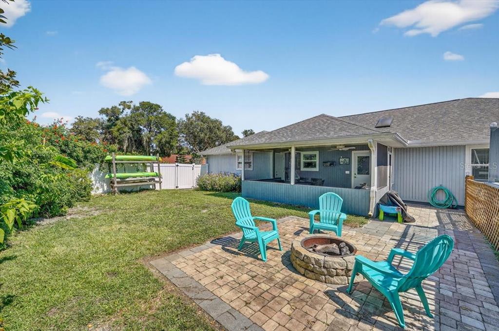 24 Heather Lane Ormond Beach, FL 32174 - Photo 10 of 50 a view of a house with backyard sitting area and garden