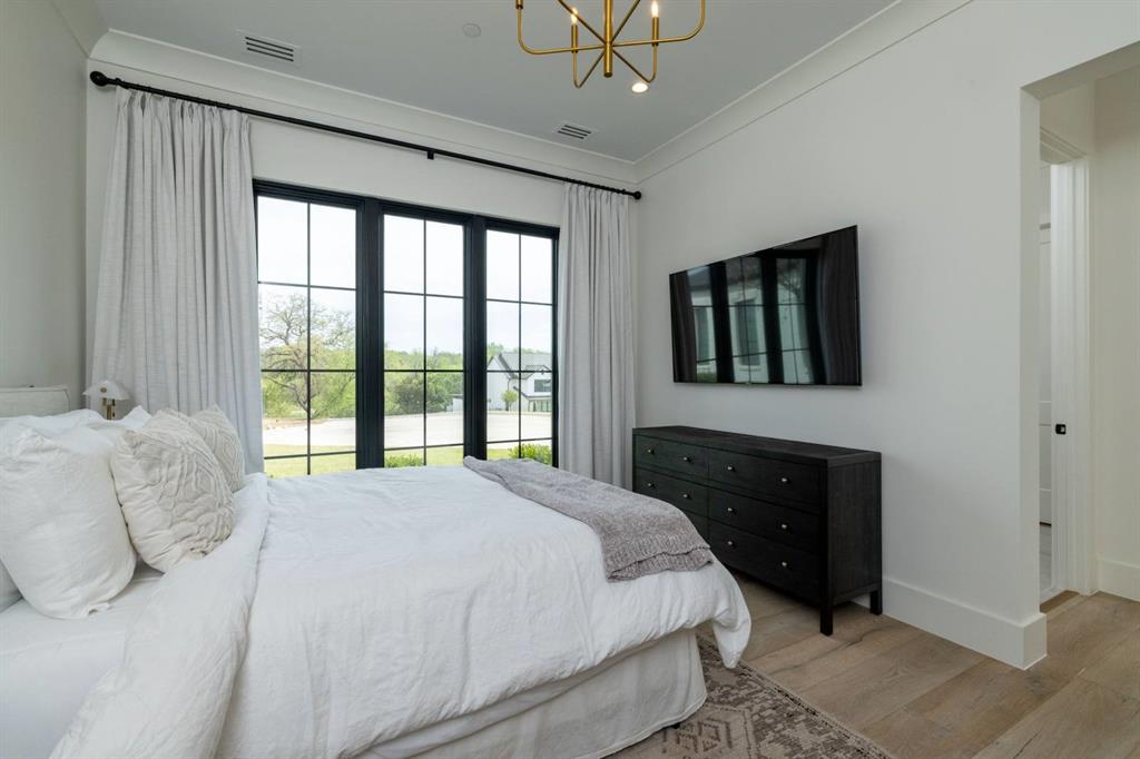 1412 Chelsea Rae Lane Keller, TX 76262 - Photo 24 of 40 Downstairs guest bedroom with an en-suite.