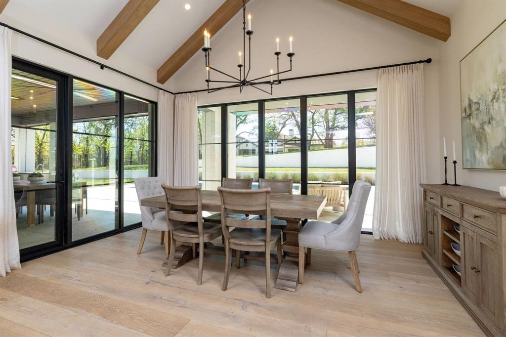 1412 Chelsea Rae Lane Keller, TX 76262 - Photo 10 of 40 The dining room with it's beautiful beams overlooks the pool and backyard living space.