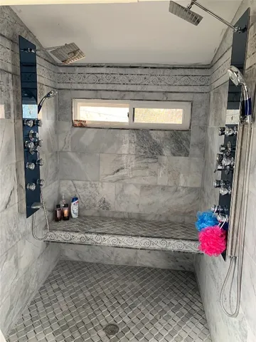a view of a bathroom with a sink and a shower