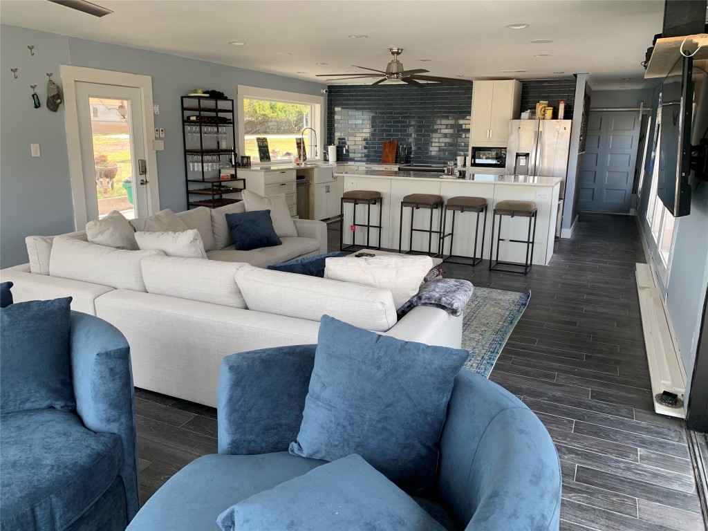 1713 Aztec Kingsland, TX 78639 - Photo 4 of 12 a living room with furniture and a wooden floor