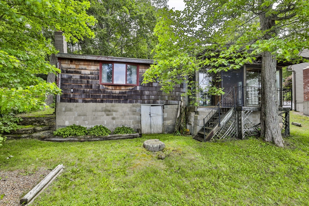 100 Stodge Meadow Road Ashburnham, MA 01430 - Photo 9 of 17 a view of a house with a yard and sitting area