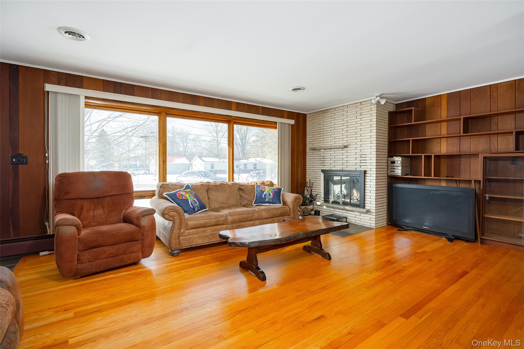201 Linden Avenue Red Hook, NY 12571 - Photo 8 of 34 a living room with furniture wooden floor and a large window
