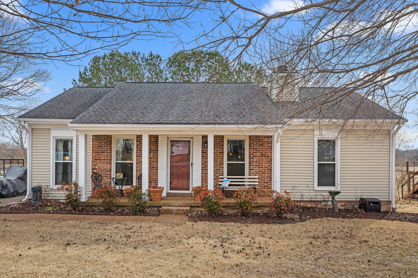 704 Riverview Drive Franklin, TN 37064 - Photo 1 of 33 a front view of a house with garden