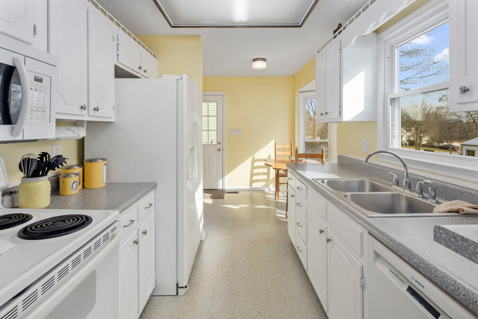 704 Riverview Drive Franklin, TN 37064 - Photo 14 of 33 a kitchen with a sink stove and cabinets
