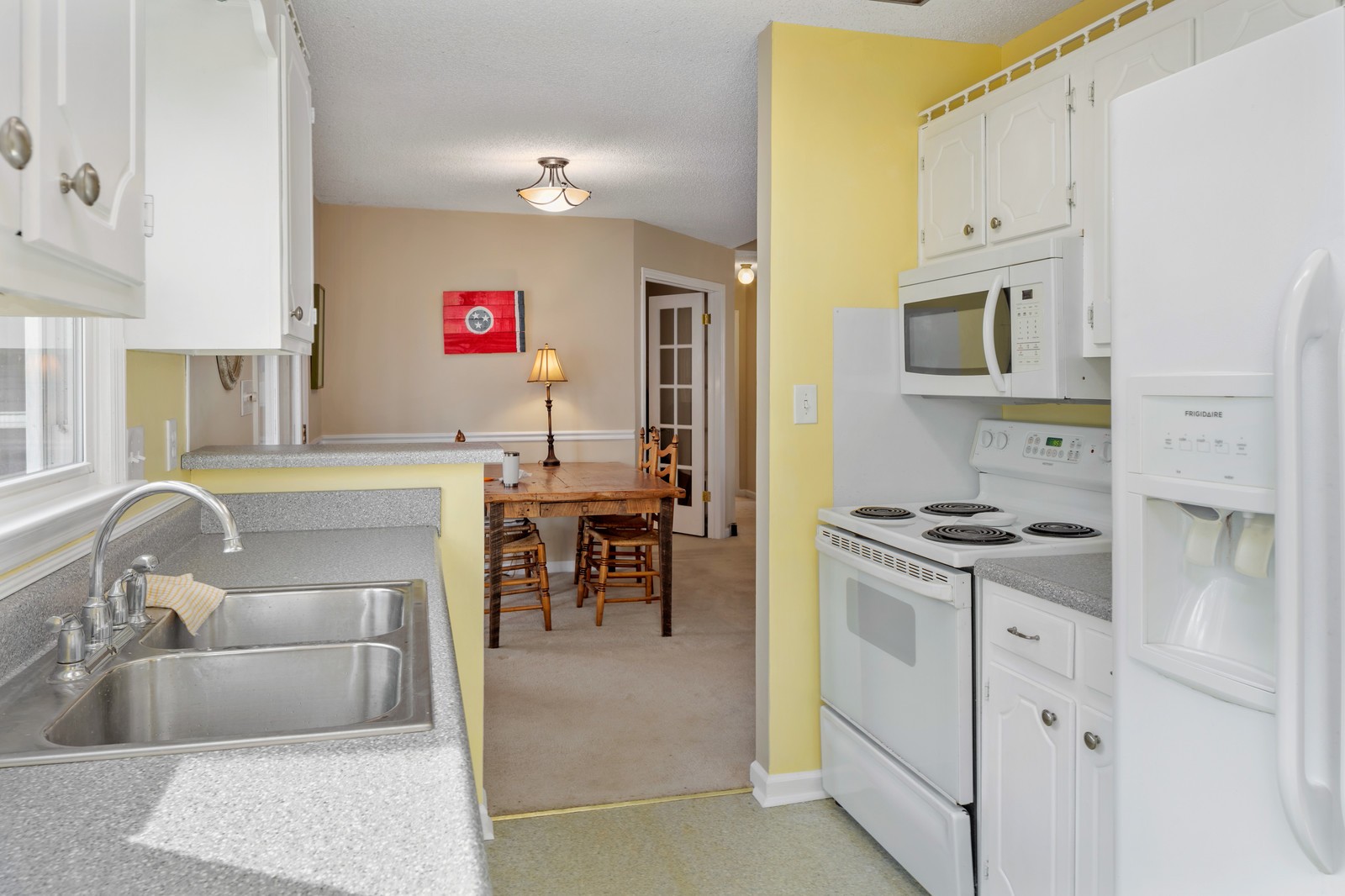 704 Riverview Drive Franklin, TN 37064 - Photo 17 of 33 a kitchen with stainless steel appliances granite countertop a stove and a sink