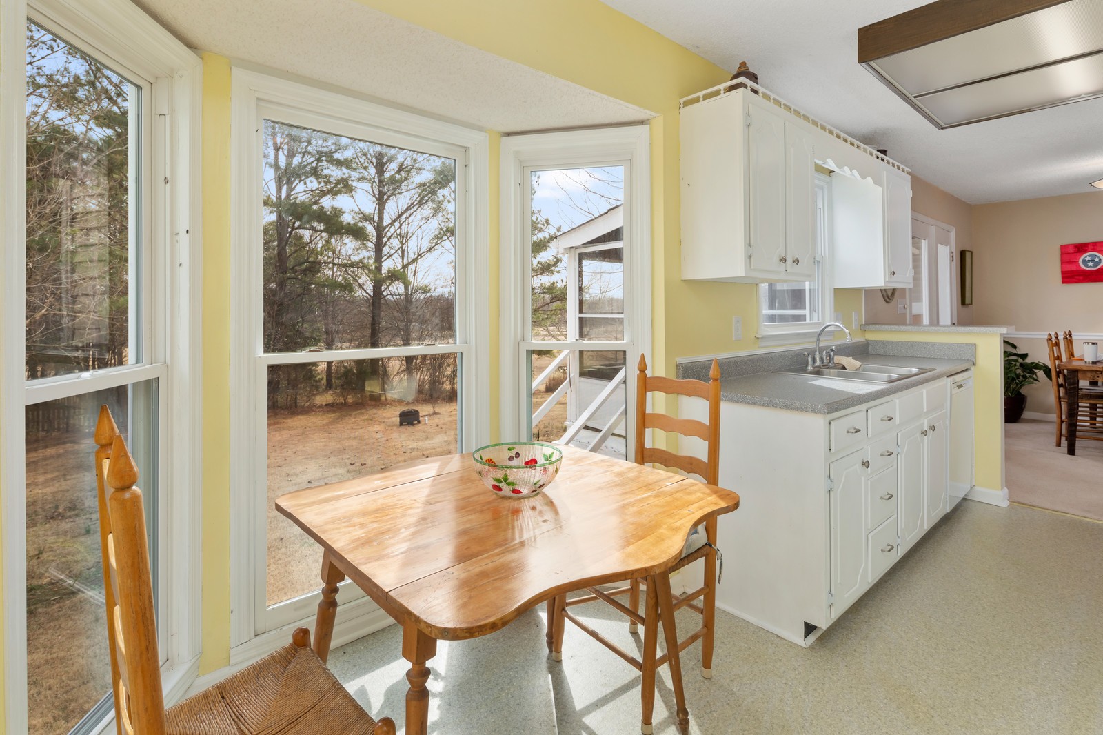 704 Riverview Drive Franklin, TN 37064 - Photo 19 of 33 a kitchen with a table chairs and cabinets