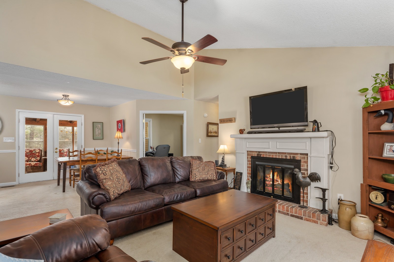 704 Riverview Drive Franklin, TN 37064 - Photo 5 of 33 a living room with furniture a flat screen tv and a fireplace