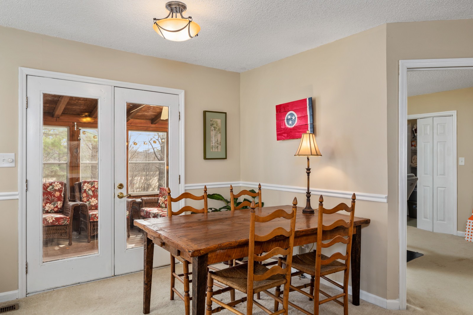 704 Riverview Drive Franklin, TN 37064 - Photo 10 of 33 a view of a dining room with furniture and a potted plant