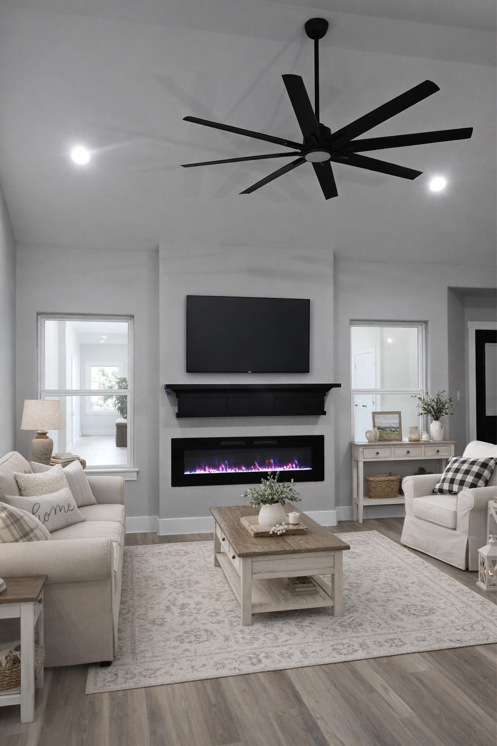 516 North Hackberry Avenue Luling, TX 78648 - Photo 2 of 36 Living area with a glass covered fireplace, recessed lighting, light wood-style flooring, and ceiling fan