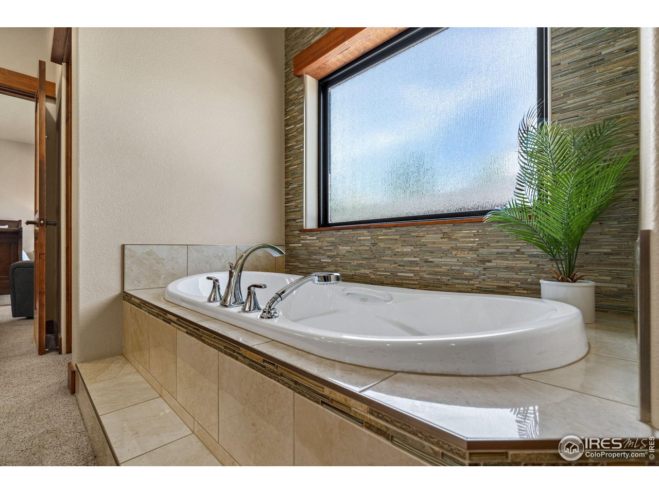 6611 Murano Drive Windsor, CO 80550 - Photo 12 of 35 a bathroom with a sink and a bathtub