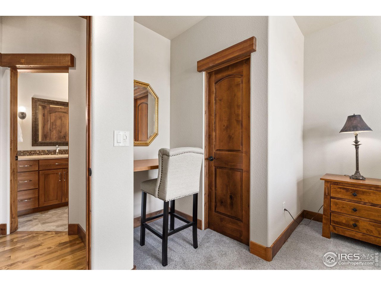 6611 Murano Drive Windsor, CO 80550 - Photo 17 of 35 a view of a kitchen from the hallway