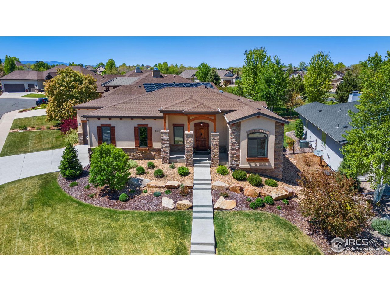 6611 Murano Drive Windsor, CO 80550 - Photo 2 of 35 a house view with a garden space