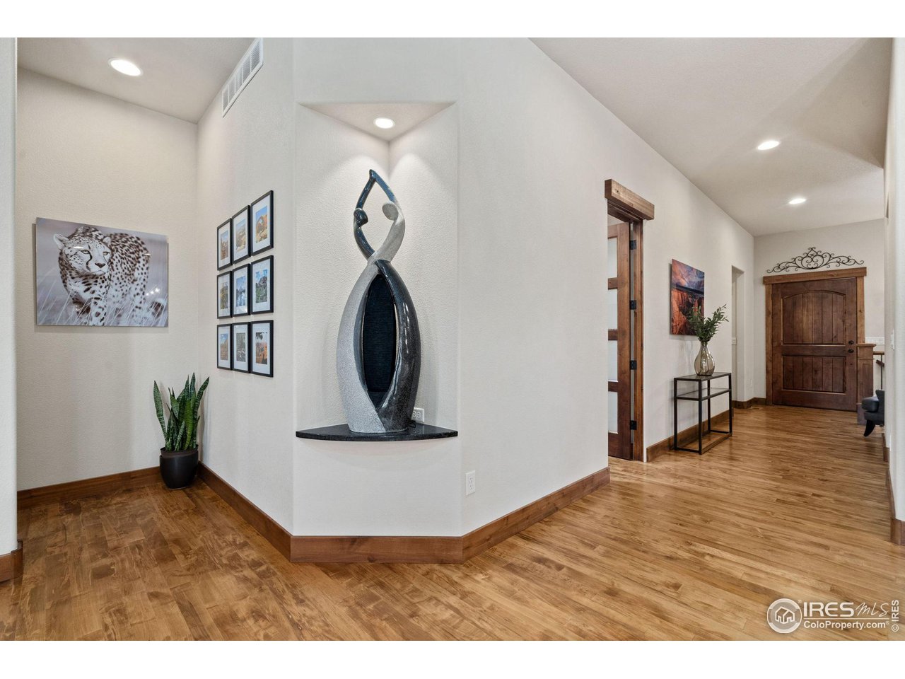 6611 Murano Drive Windsor, CO 80550 - Photo 29 of 35 a view of livingroom with furniture and wooden floor