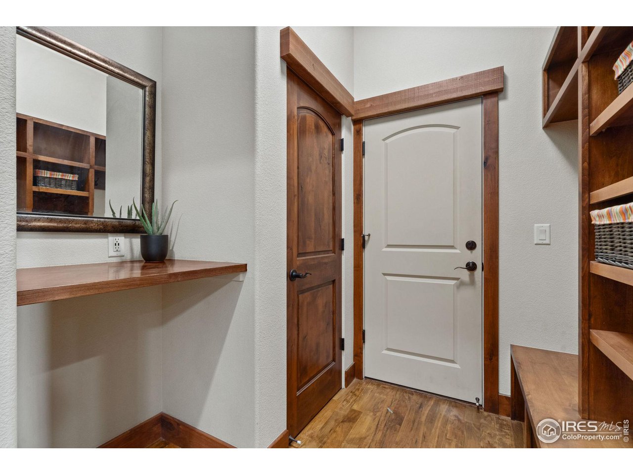 6611 Murano Drive Windsor, CO 80550 - Photo 31 of 35 a view of a kitchen from the hallway